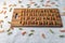 Bamboo cut board  with vegetable pasta orange and green color on a white linen tablecloth