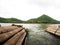 Bamboo floating raft in high mountain lake panorama view