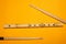 Bamboo flute and drumsticks. simple music instruments