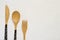 Bamboo fork, knife and spoon on white background closeup, Top vi