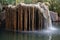 bamboo fountain dripping water on rocks