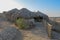 Bamboo houses with dry reeds roof. Simple shelters with stone retaining walls of Egyptian natives in poor areas off the Red Sea.