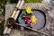 Bamboo ladle on a stone basin filled with a flower arrangement in Kyoto Japan