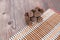 Bamboo mat on the table and a pile of Chinese medicine Maple balls