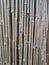 Bamboo poles background texture that tiles seamlessly as a pattern.