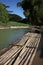 Bamboo rafts prepared & ready for a popular tourist day trip on the Martha Brae river, Falmouth, Jamaica. Close to Montego Bay.