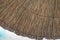 Bamboo or reed or straw beach umbrella