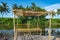 Bamboo shack on the pond and Coconut trees.