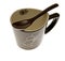 Bamboo spoon on empty Japanese coffee cup