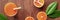 Bamboo straw panorama on a rustic wooden background, fresh orange juice with blood oranges