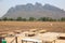 Bamboo table on the ground, soil, plains, drought, countryside, Asia, mountain and sky view background