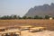 Bamboo table on the ground, soil, plains, drought, countryside, Asia, mountain and sky view background