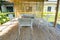 Bamboo terrace and dining table in the morning sun.