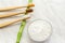 Bamboo toothbrush, bamboo plant dentifrice tooth powder on white marble background.Flat lay copy space.Biodegradable natural