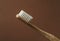 Bamboo toothbrush on carton background macro