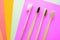 Bamboo toothbrushes on multicolored bright background in trendy colors