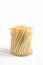 Bamboo toothpicks in a plastic storage box on white background. Vertical view, selective focus