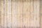 Bamboo wood fence texture with steel nail patterns ,  light brown seamless background