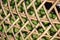 Bamboo wood with woven seamless crafts pattern on green background