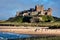 BAMBURGH, NORTHUMBERLAND/UK - AUGUST 15 : View of Bamburgh Castle in Northumberland on August 15, 2010. Unidentified people.
