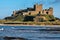 BAMBURGH, NORTHUMBERLAND/UK - AUGUST 15 : View of Bamburgh Castle in Northumberland on August 15, 2010. Unidentified people.