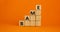 BAME symbol. Abbreviation BAME, black, asian and minority ethnic on wooden cubes. Beautiful orange background. Copy space.
