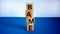BAME symbol. Abbreviation BAME, black, asian and minority ethnic on wooden cubes. Beautiful white and blue background. Copy space