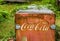Bamfield BC Canada - August 06, 2017 Old red rusty Coca-Cola refrigerator in backyard.