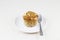 Banana almond muffin on plate with fork