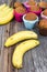 Banana with banana cup cake in colorful baking pan.