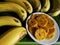 Banana chips are foods made from thinly sliced bananas and then fried using spiced flour.