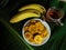 Banana chips are foods made from thinly sliced bananas and then fried using spiced flour.