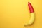 Banana with condom on orange background, top view and space for text. Safe sex concept