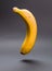 A banana floating in the air in vertical composition