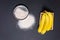 Banana flour on a black background top view