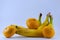 Banana and group of tangerines, mandarins isolated over white