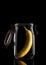 A Banana inside a glass storage or canning jar isolated on black with reflection, with lid open