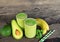 Banana Juice and avocado smoothies and green juice drink healthy, delicious taste in a glass for weight loss on wooden background
