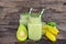 Banana Juice and avocado smoothies and green juice drink healthy, delicious taste in a glass for weight loss on wooden background.