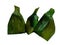 Banana leaf packaging sticky rice on white background