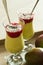 Banana and mango smoothie dessert in wine glasses