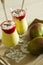 Banana and mango smoothie dessert in wine glasses