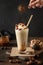 Banana milkshake garnish caramel and whipped cream sprinkled cacao powder on dark