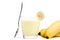 Banana milkshake with a piece of banana and spoon