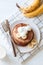 Banana pancakes with whole wheat flour on white background top view, bananas, yogurt and glass of milk. Healthy breakfast, morning