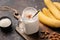 Banana protein smoothie or milkshake with cinnamon and coconut