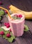 Banana raspberry smoothie on table