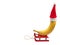 Banana in a red Christmas hat sits on a sled