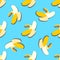 Banana seamless pattern in paper cut style. Origami yelllow tropical fruit on blue.