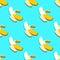 Banana seamless pattern in paper cut style. Origami yelllow tropical fruit on blue.